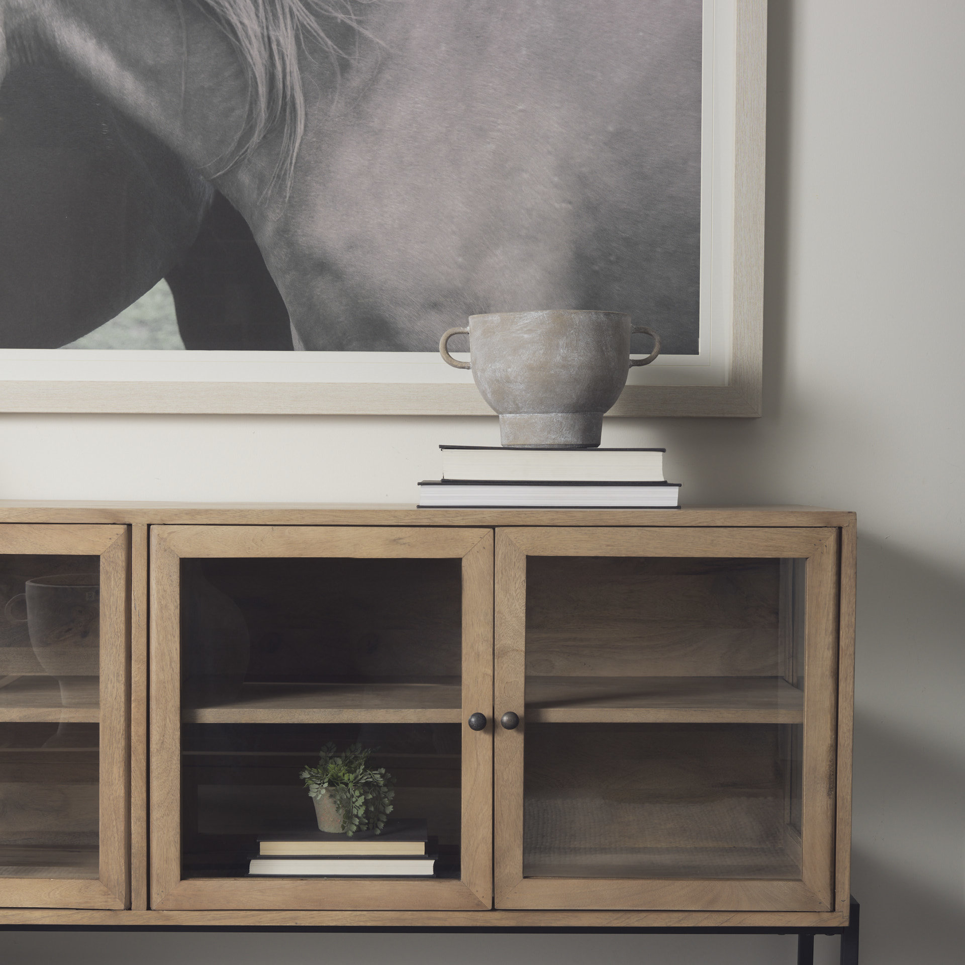 arelius 70l x 18w x 32h light brown wood, black metal base w/ 4 glass cabinet doors sideboard
