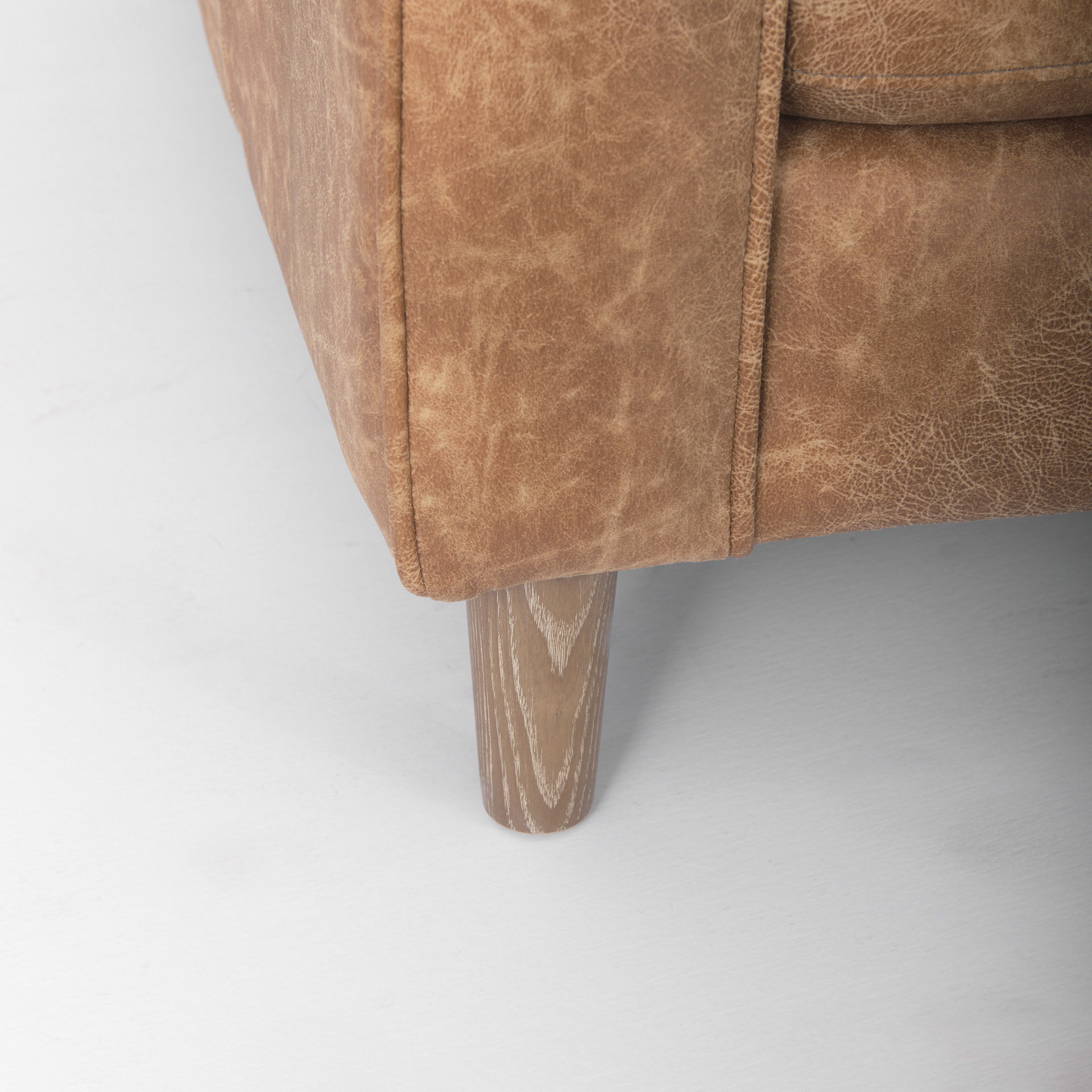 loretta 88.0l x 36.2w x 33.9h cognac brown faux leather three seater sofa with two bolster cushions
