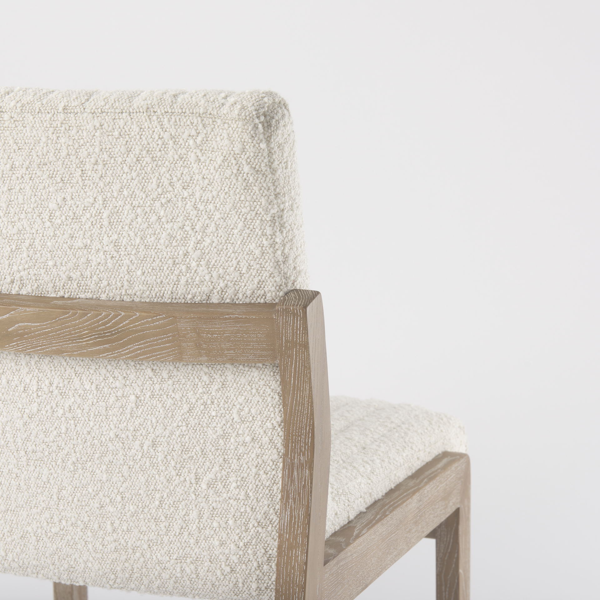 tahoe cream boucle upholstered and light brown wood armless dining chair