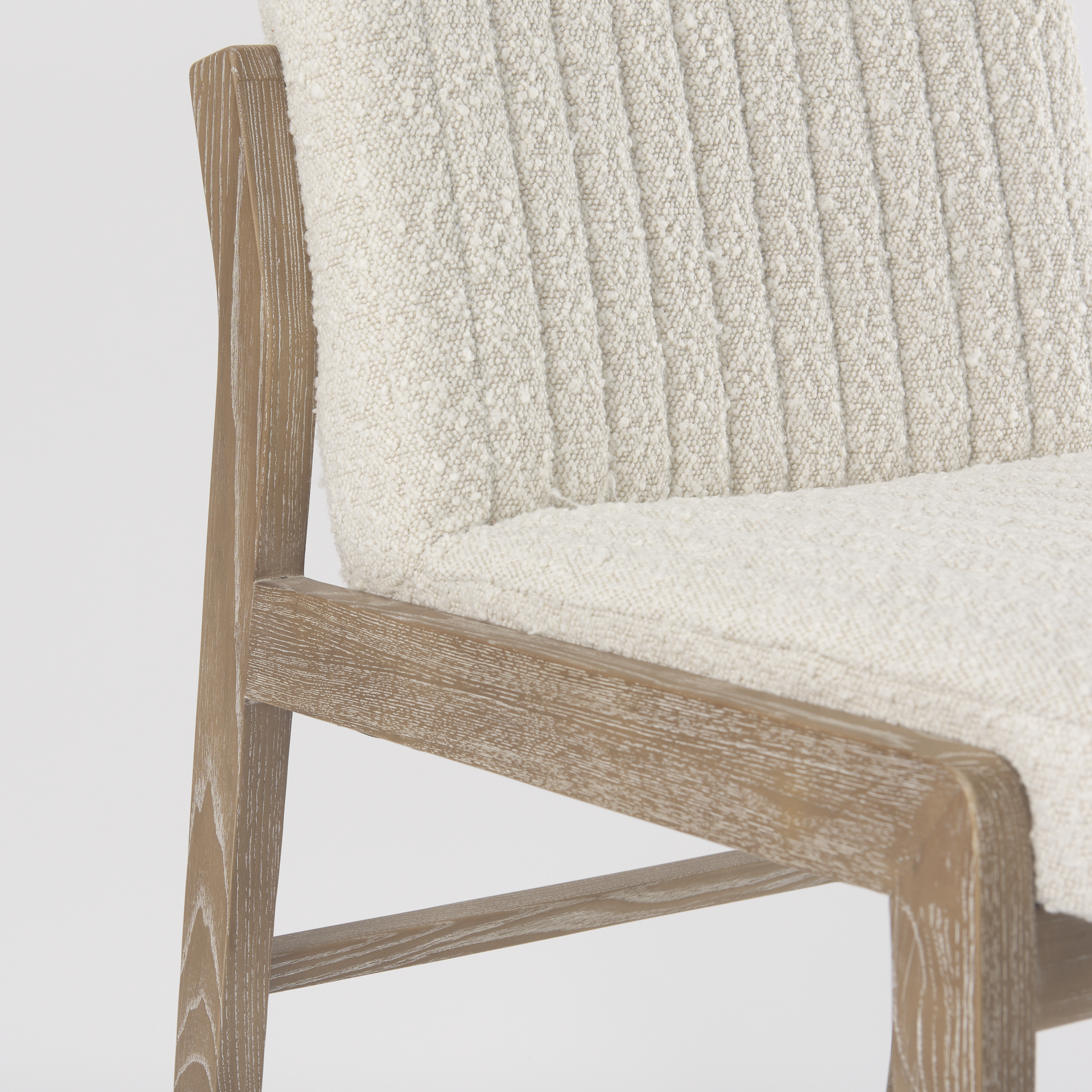 tahoe cream boucle upholstered and light brown wood armless dining chair