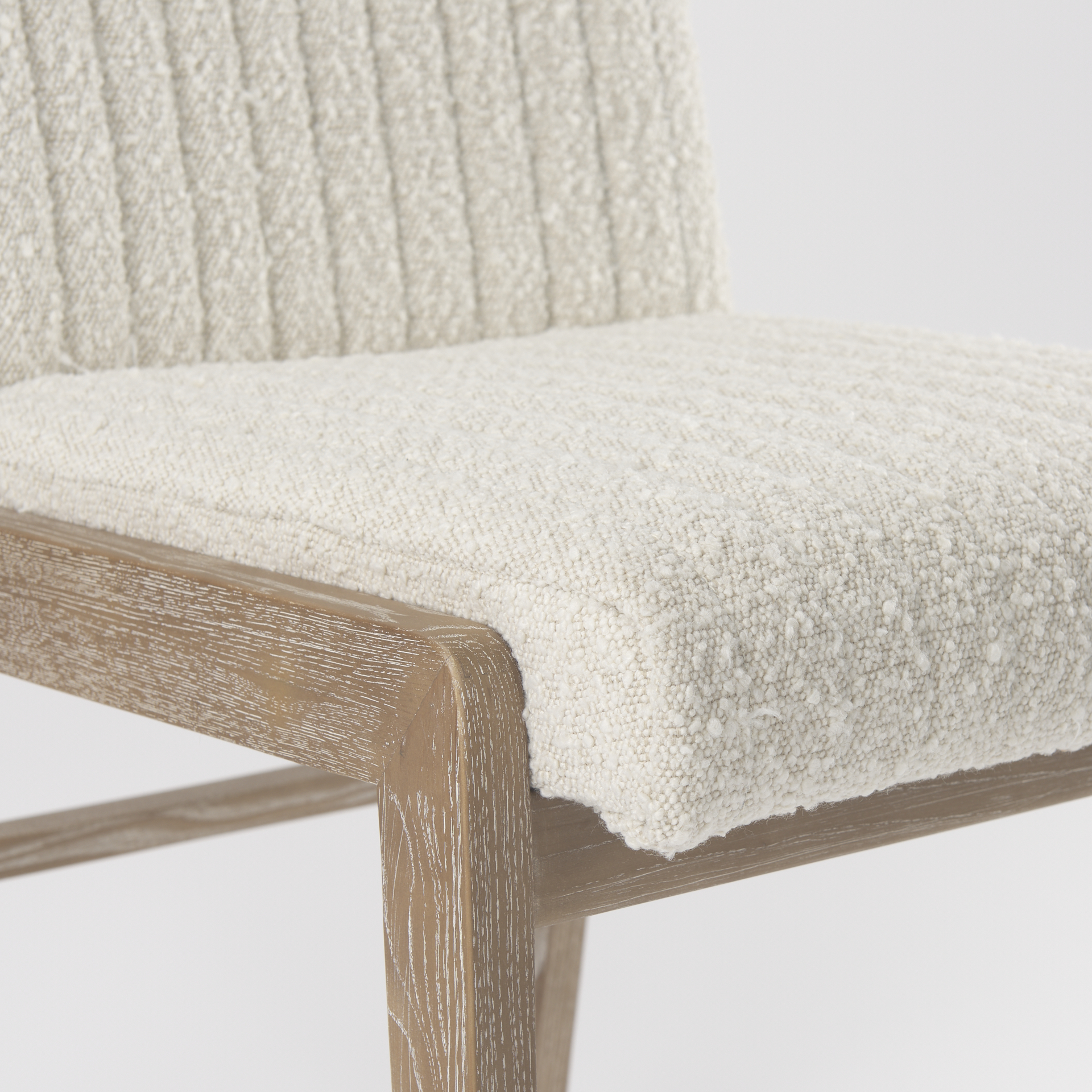 tahoe cream boucle upholstered and light brown wood armless dining chair