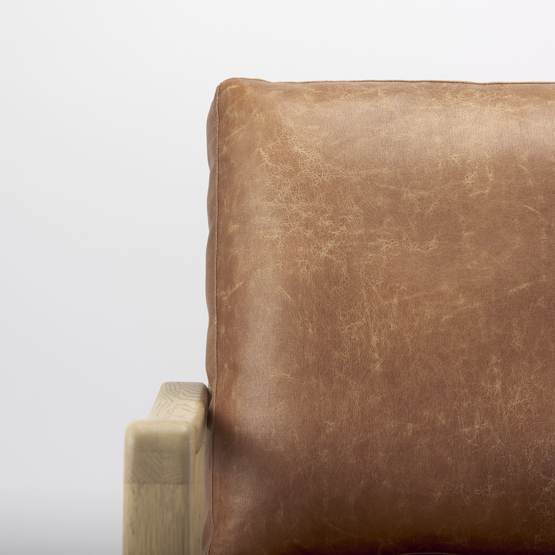 raeleigh tan faux leather accent chair