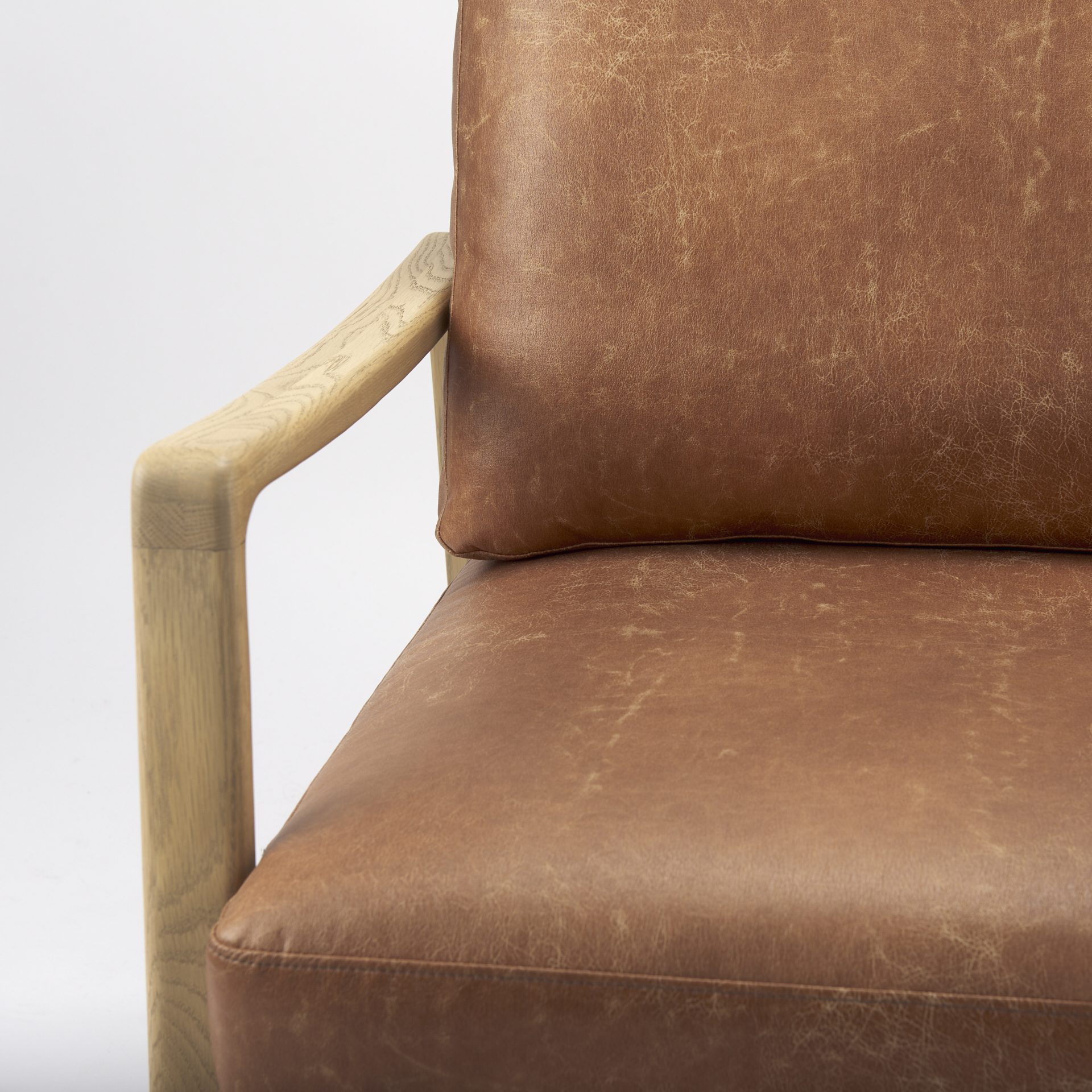 raeleigh tan faux leather accent chair