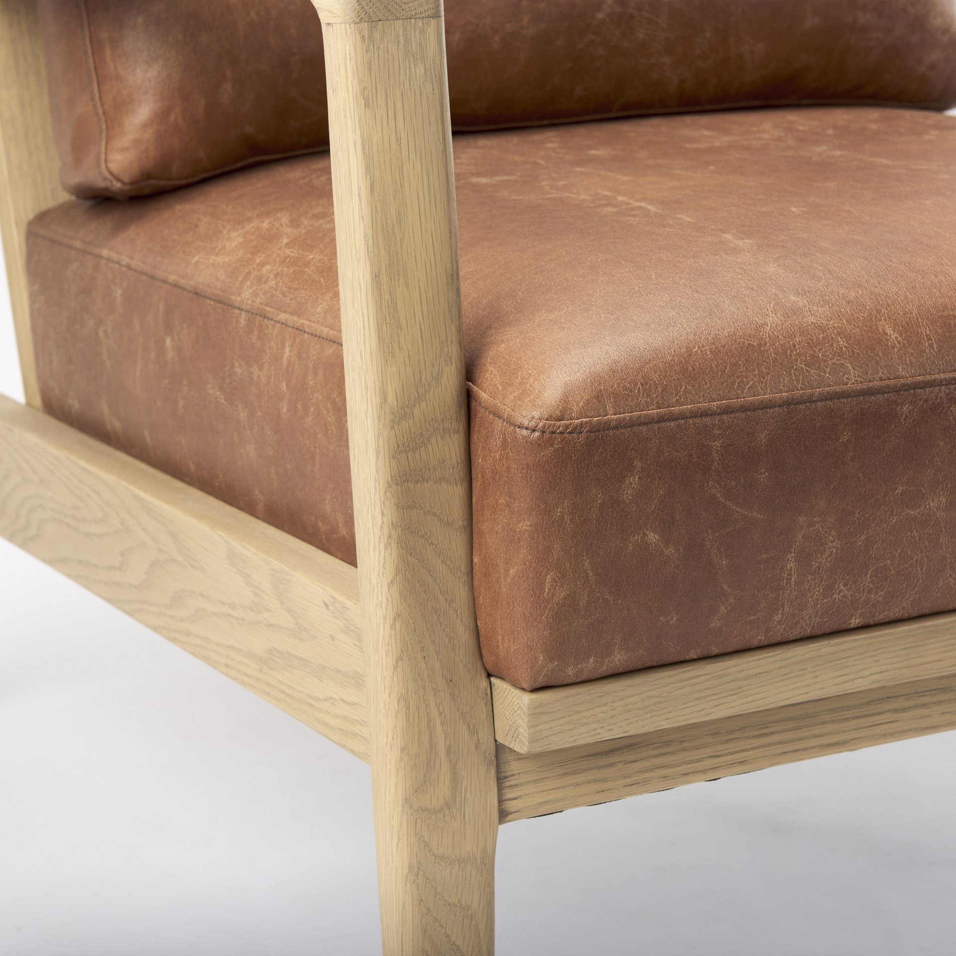 raeleigh tan faux leather accent chair