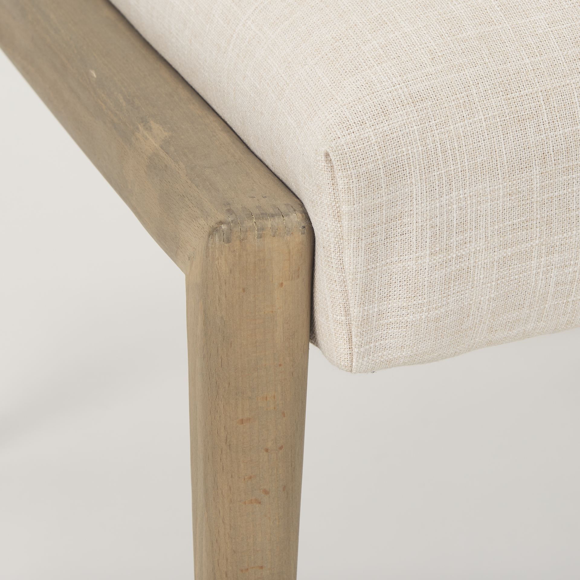 palisades cream upholstery w/ solid wood armless dining chair