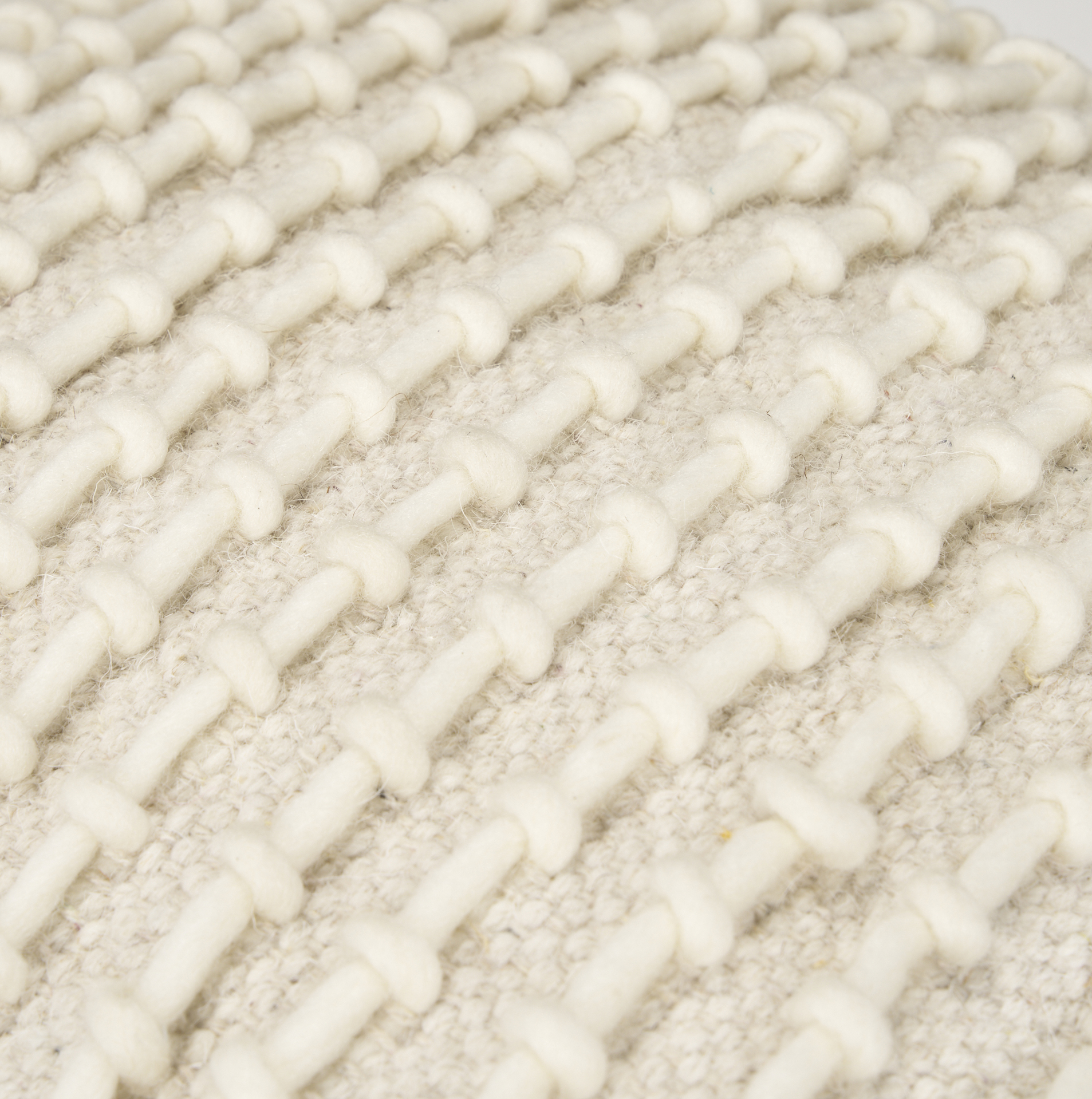 sakaye beige w/ cream stitched patterned pouf