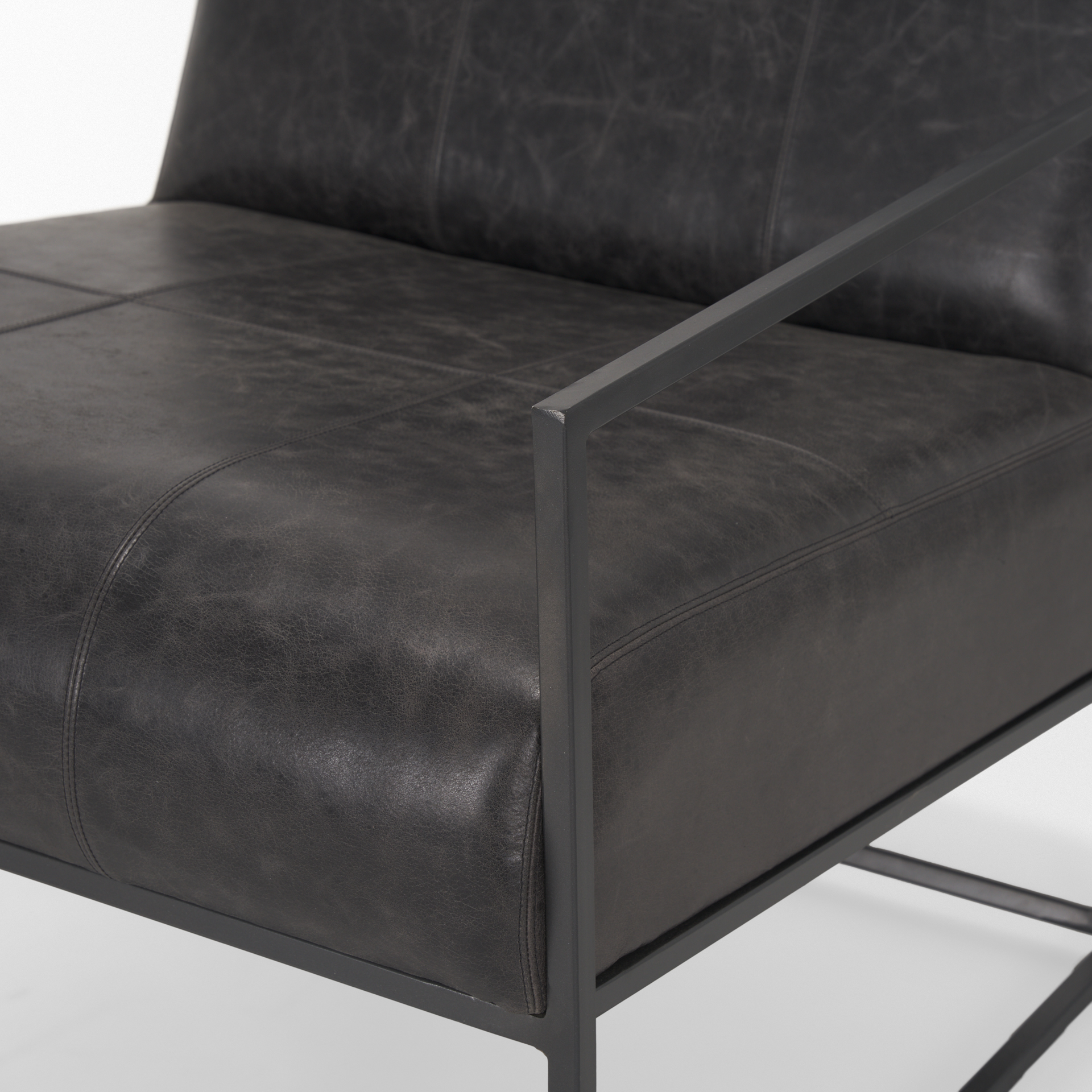 stratton gunmetal w/ genuine aged black leather upholstered accent chair