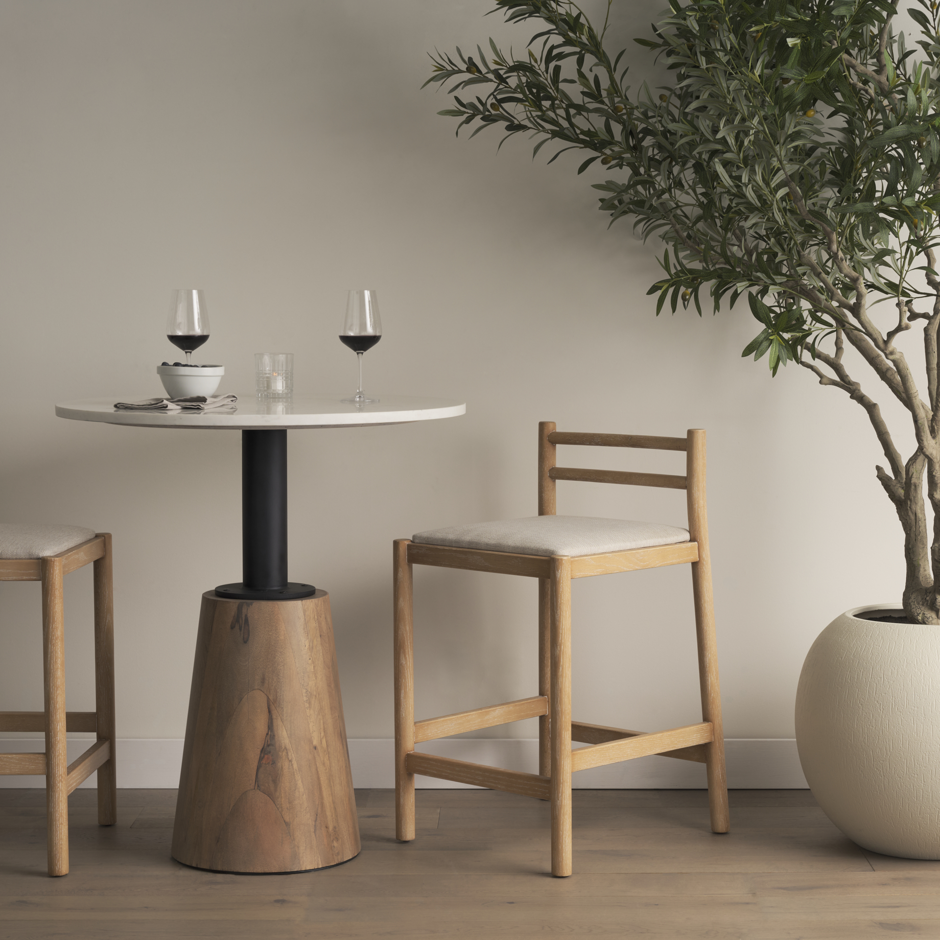 sam counter stool w/ light brown wood frame and beige upholstered seat