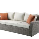 Three Piece Outdoor Wicker Sectional with Beige Cushions and Table