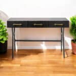 Black Writing Desk With Three Drawers and Gold Accents