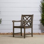 Distressed Outdoor Armchair With Decorative Back and Armrests