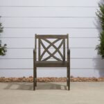 Distressed Outdoor Armchair With Decorative Back and Armrests