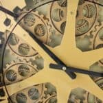 Industrial Black and Copper Wall Clock with Exposed Gears