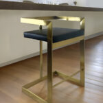 26 Inch Black and Gold Faux Leather Bar Stool
