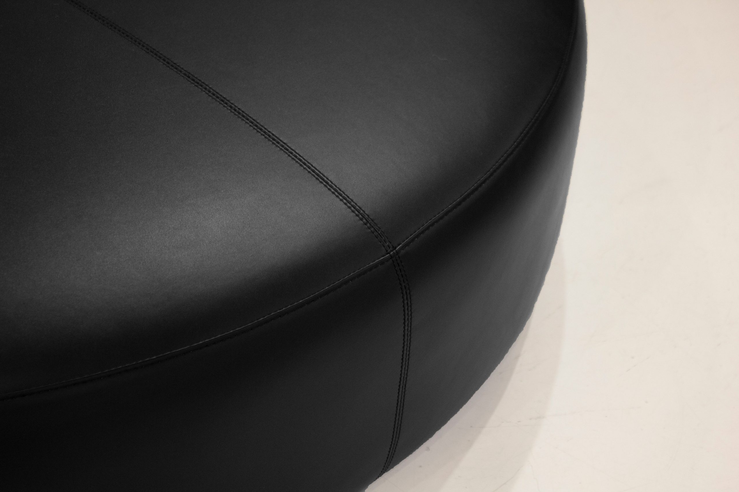 DISC Black Leatherette 48" Round Ottoman 2 DISC Black Leatherette 48" Round Ottoman - Image 2
