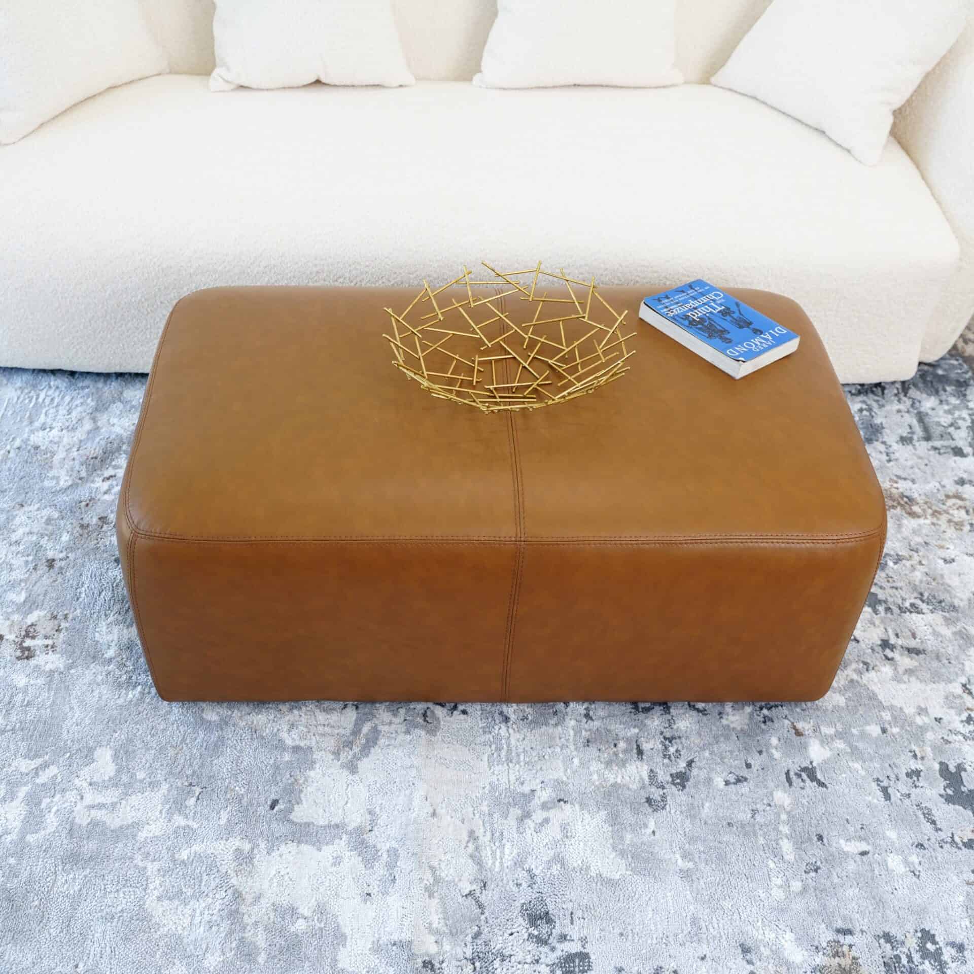 Tan Leather Ottoman with Space-Saving Design and Versatile Style 1 Tan Leather Ottoman with Space-Saving Design and Versatile Style