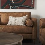 Loretta 88.0L x 36.2W x 33.9H Cognac Brown Faux Leather Three Seater Sofa with Two Bolster Cushions