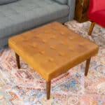 Tan Leather Mid-Century Tufted Ottoman with Solid Wood Legs 8 Tan Leather Mid-Century Tufted Ottoman with Solid Wood Legs