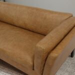 Tan Leather Sofa with Walnut Legs and Compact Design