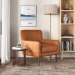 Tan Leather Mid-Century Modern Lounge Chair With Tapered Walnut Legs and Round Arms