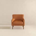 Tan Leather Mid-Century Modern Lounge Chair With Tapered Walnut Legs and Round Arms