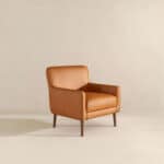Tan Leather Mid-Century Modern Lounge Chair With Tapered Walnut Legs and Round Arms