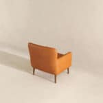Tan Leather Mid-Century Modern Lounge Chair With Tapered Walnut Legs and Round Arms