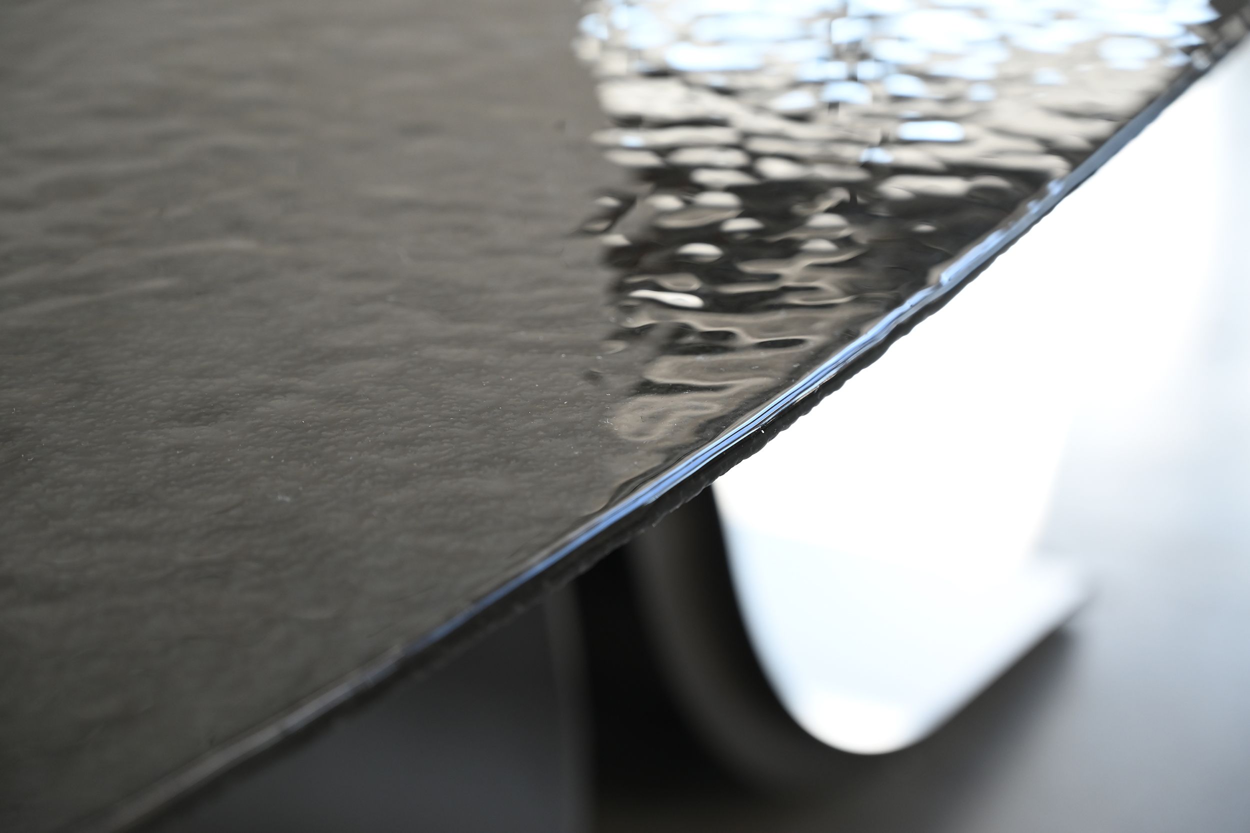 ponza black modern melt glass oval dining table