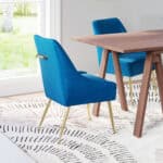 Navy Blue Velvet Armchair with Gold Legs and Cushioned Back