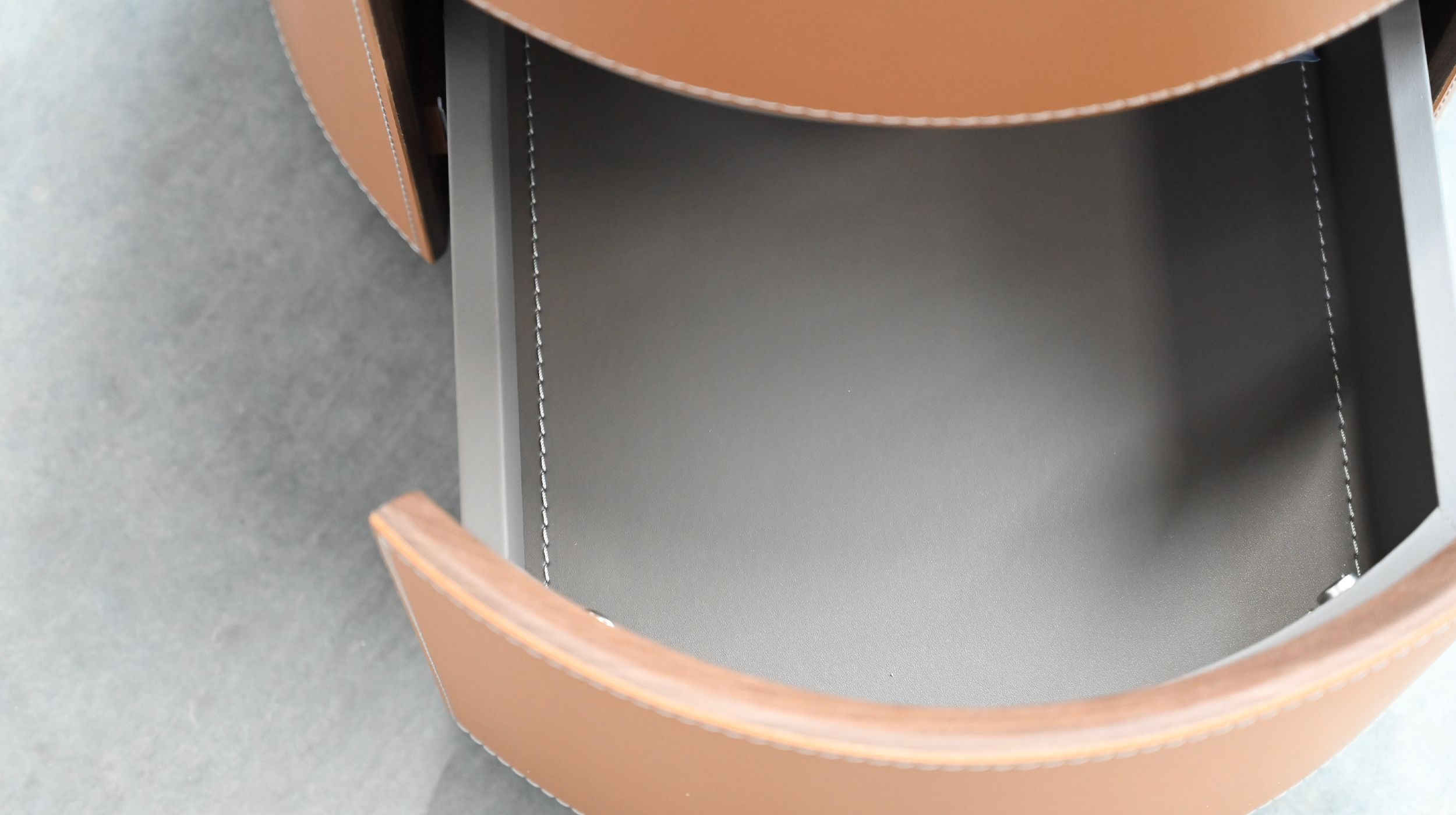 merc tan leather round side table with drawer