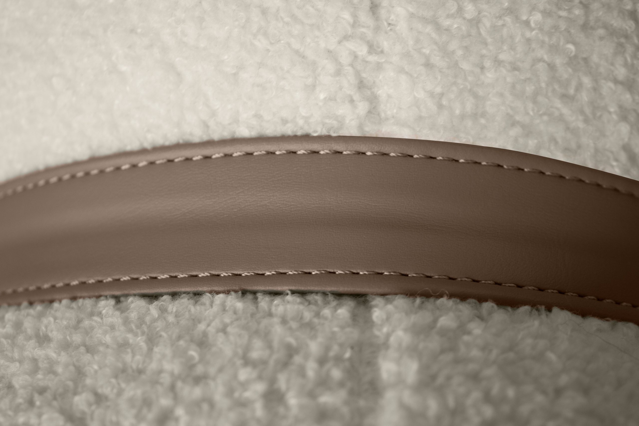cumulus cream boucle fabric sofa with leather strap